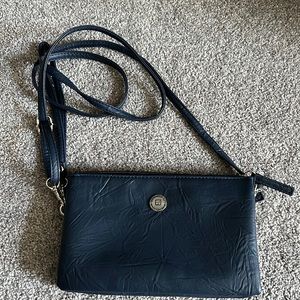 Stone Mountain cross body purse with phone charger. Never used!
